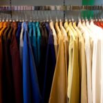 close-up-of-clothes-hanging-in-row-739240657-5a78b11f8e1b6e003715c0ec